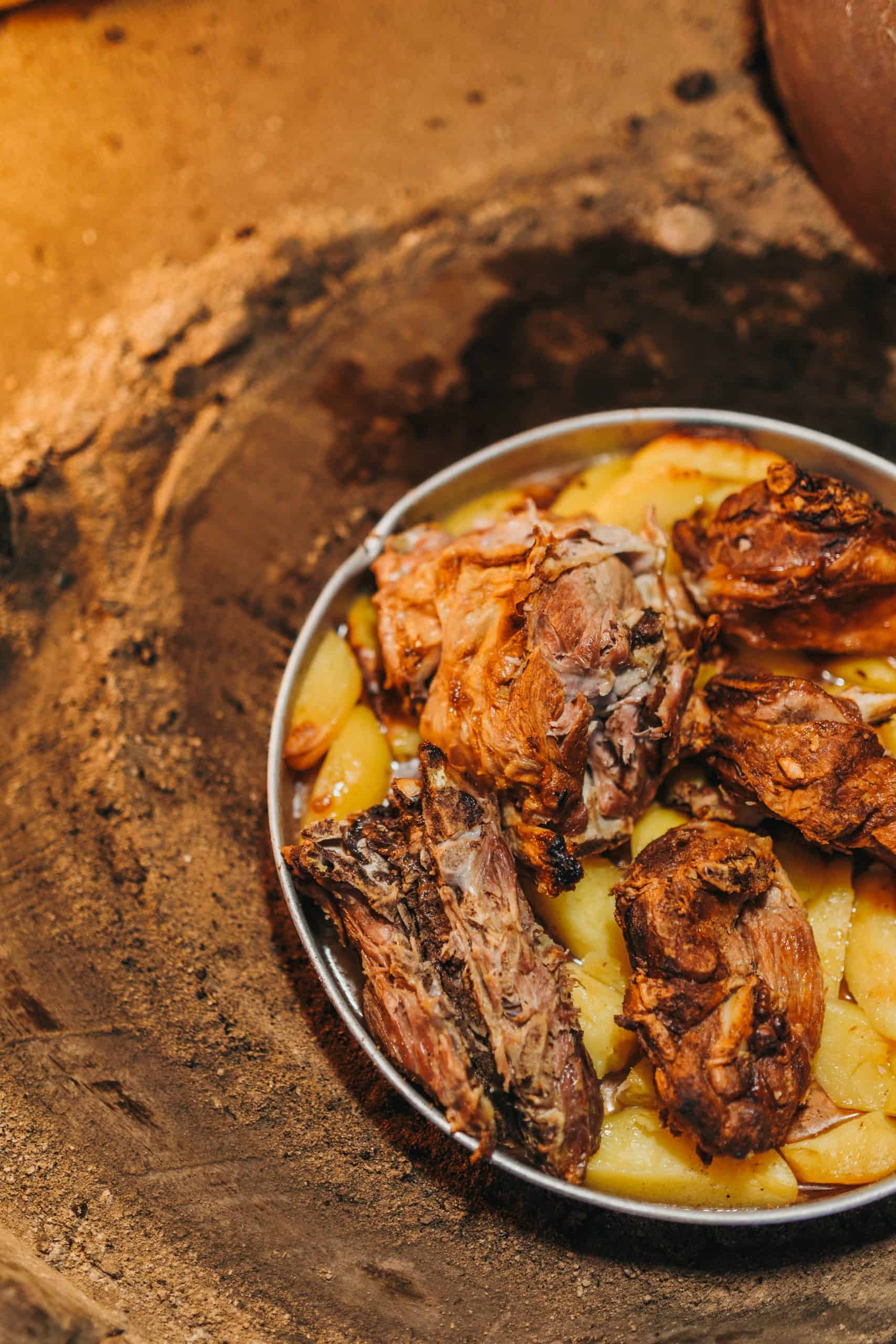 Fresh peka cooked over open flame in traditional style, ready for guests at Dubrovnik local food spot
