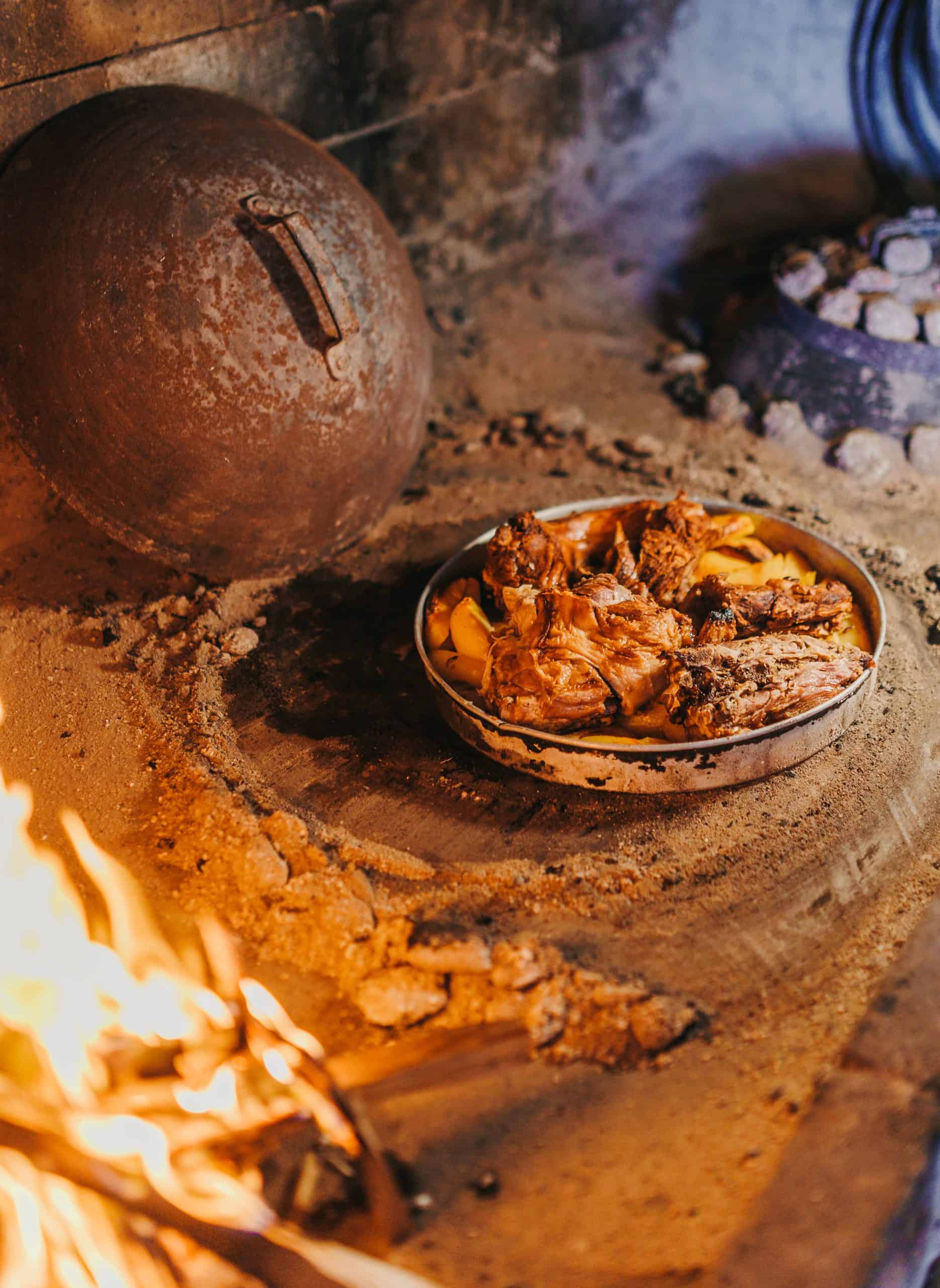 Iron bell lid covering the peka dish as it slow cooks in open flame at Dubrovnik restaurant