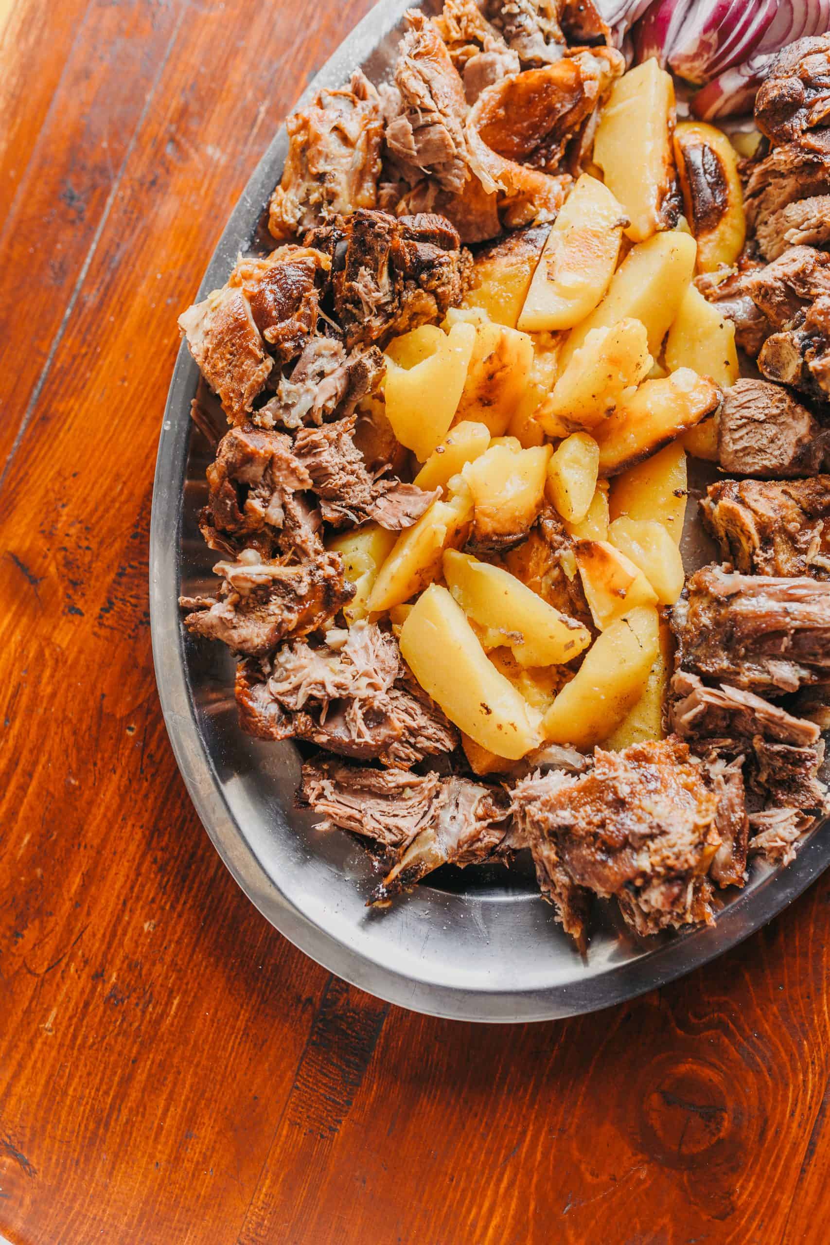 Famous Dubrovnik peka dish served hot at local restaurant near Old City walls